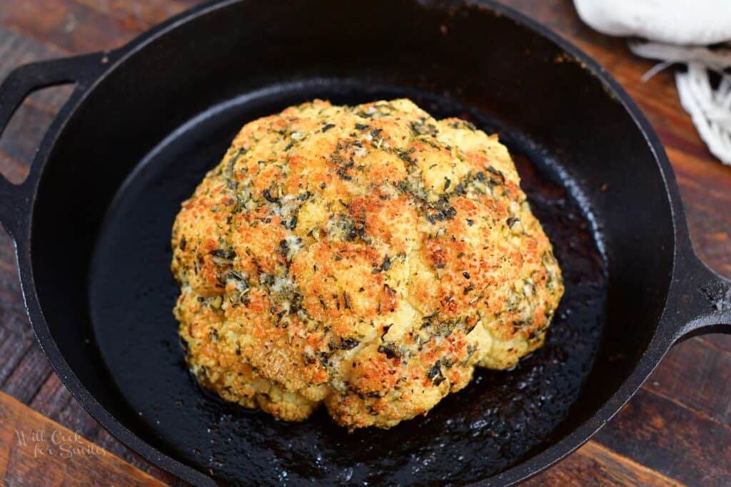 whole cauliflower roasted in a skillet