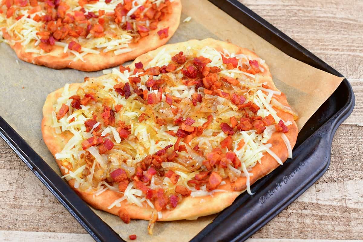 flatbread crust topped with cheese bacon and caramelized onion