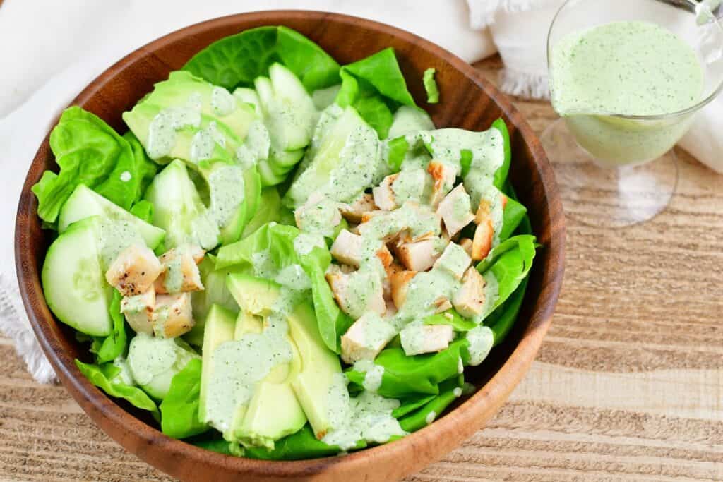 green salad topped with green goddess dressing