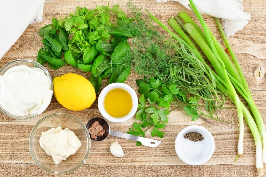 ingredients for green goddess dressing in light wood