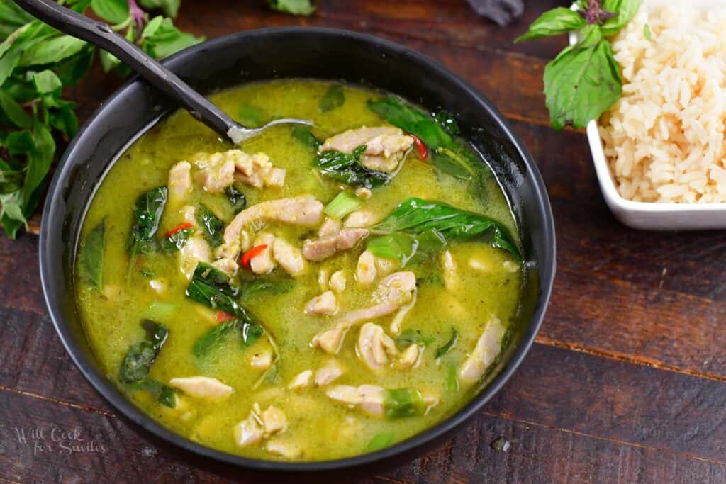 closeup of Thai green curry with chicken in a bowl