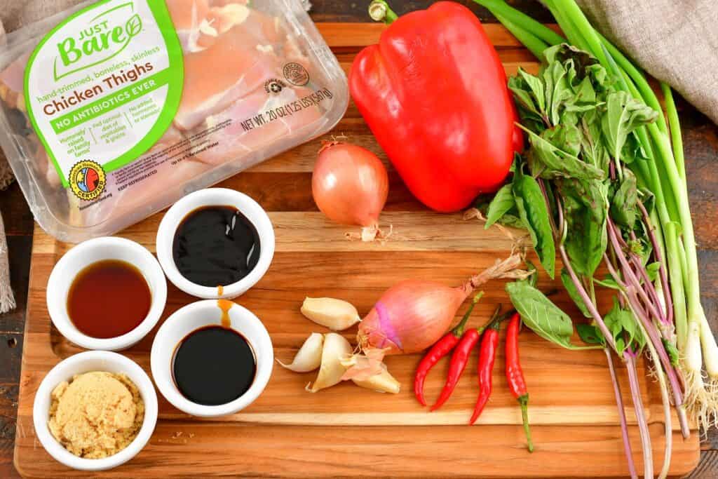 ingredients to make Thai basil chicken on the board