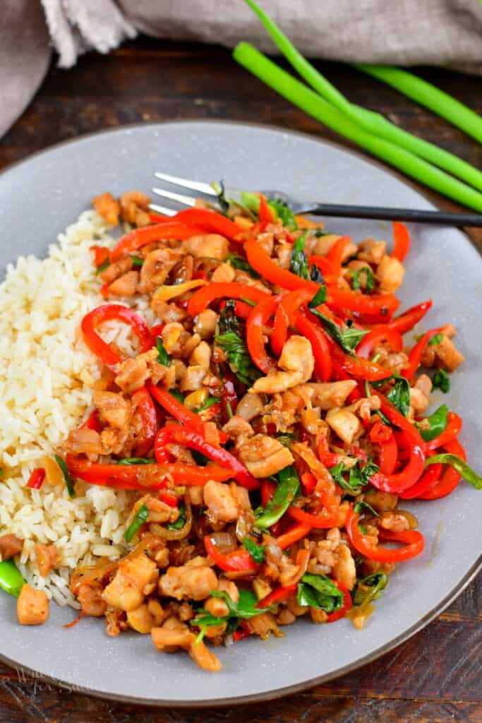 top view of basil chicken with rice on a plate