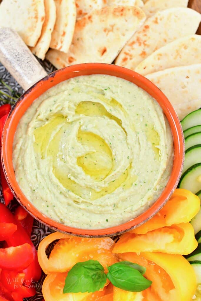 top view of the white bean dip in a bowl with dippings