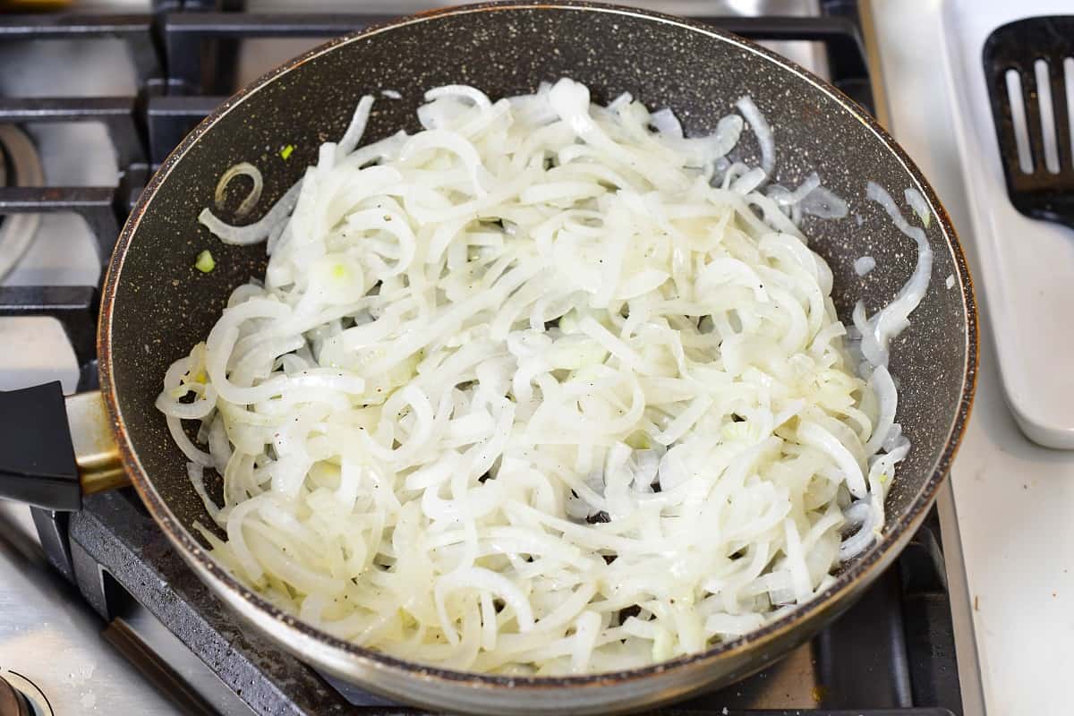 onions starting to cook in the large pan