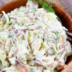 closeup of potato salad in a wooden bowl