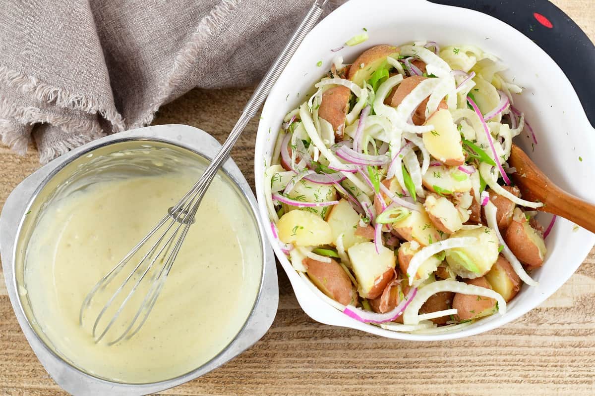 ingredients for potato salad and ingredients for the dressing mixed