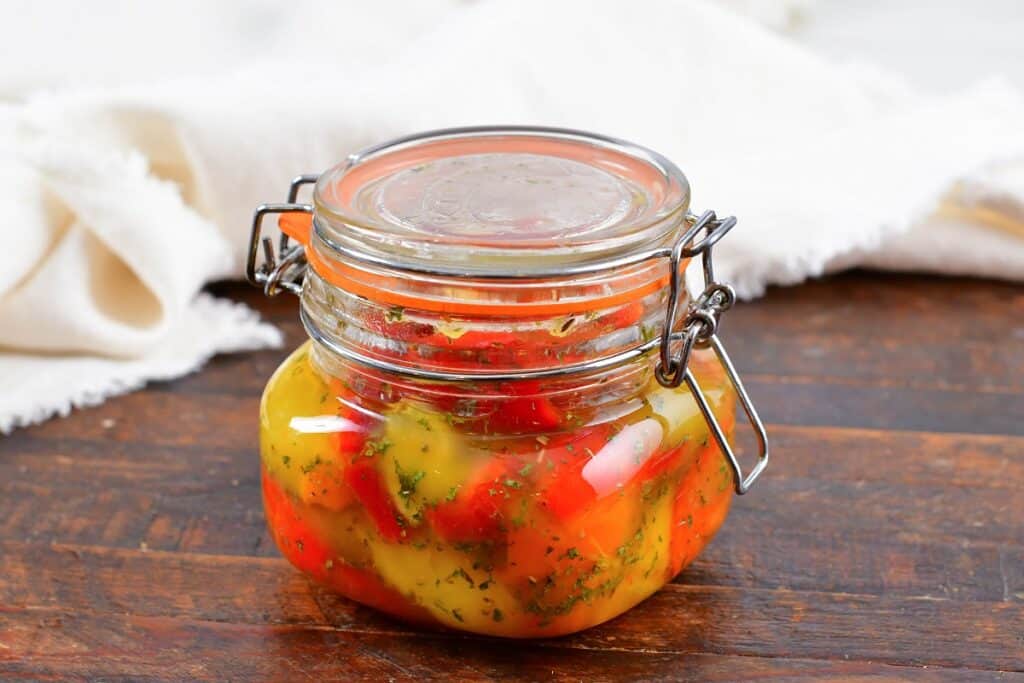 roasted peppers in oil in a closed jar