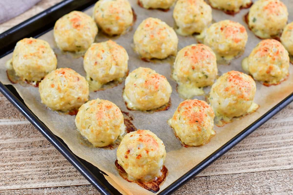 baked chicken meatballs on a baking sheet