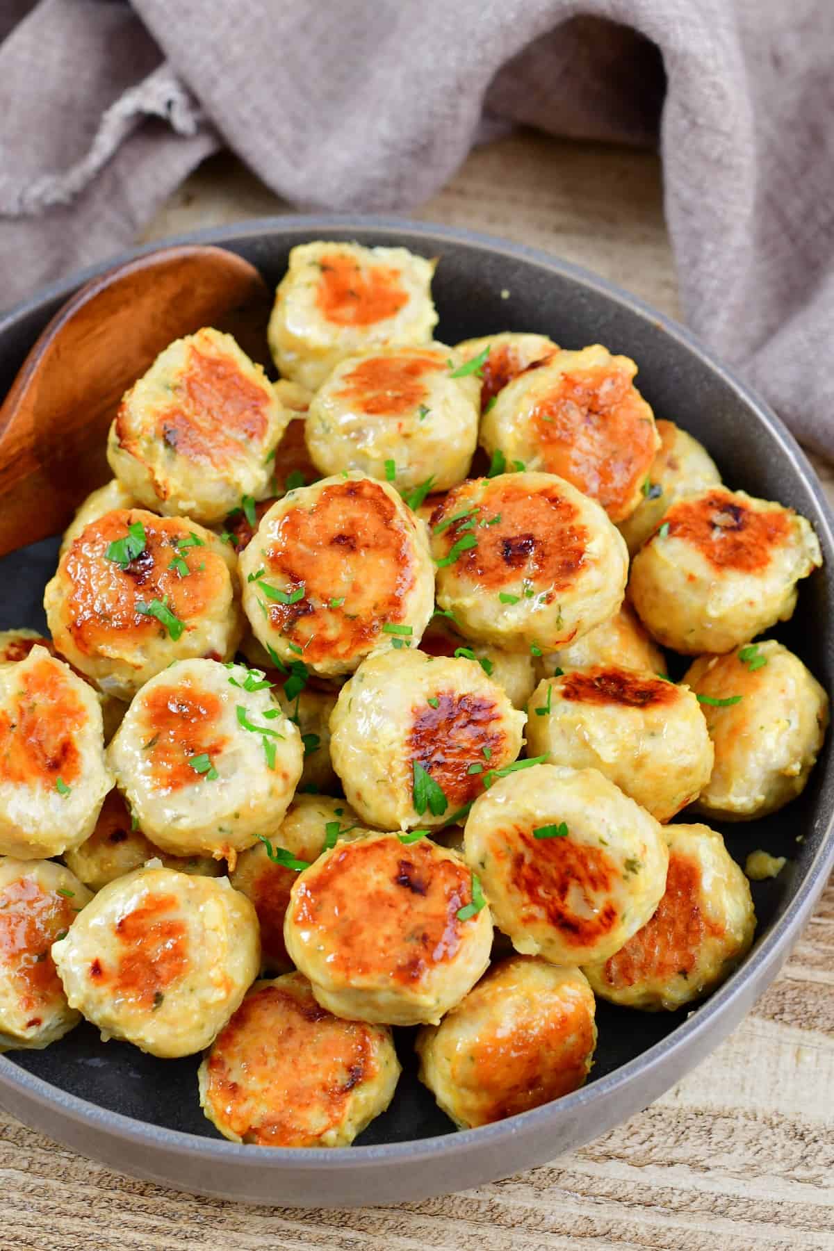 top view of cooked chicken meatballs in a bowl