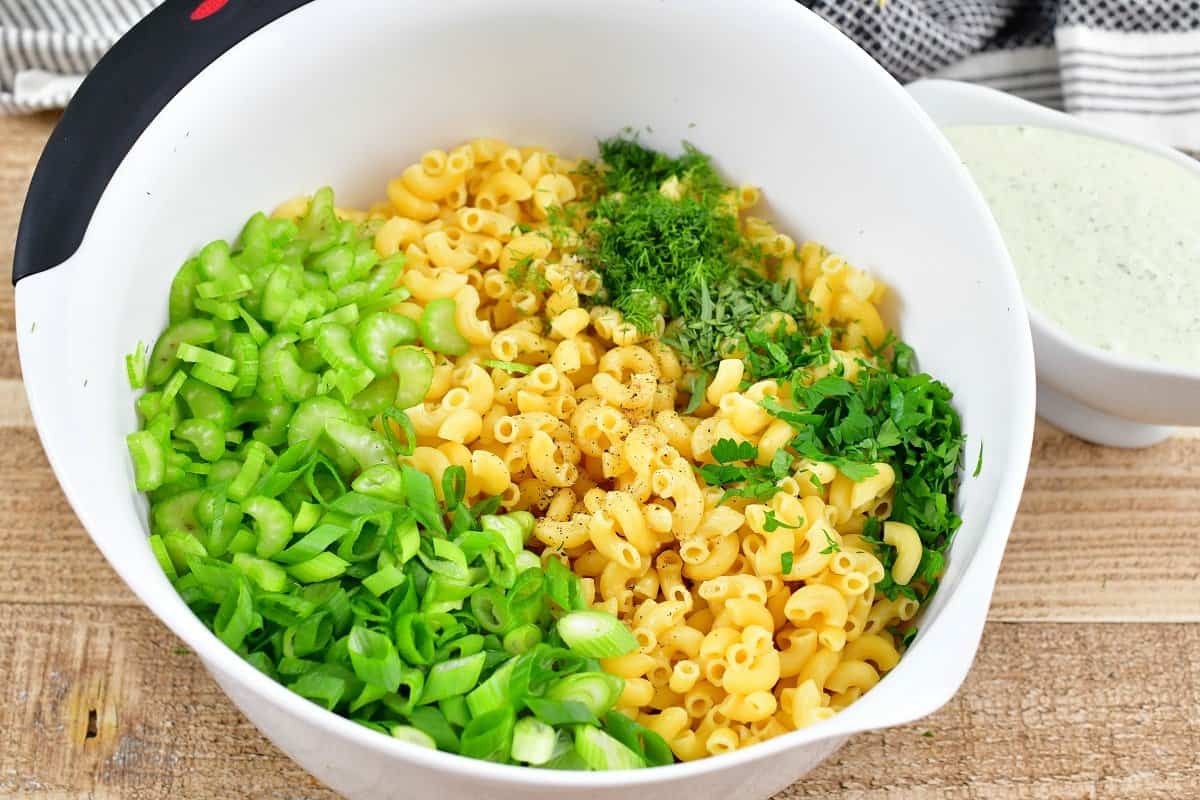 pasta and other green ingredients in a bowl