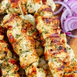 closeup of grilled chicken souvlaki on skewers