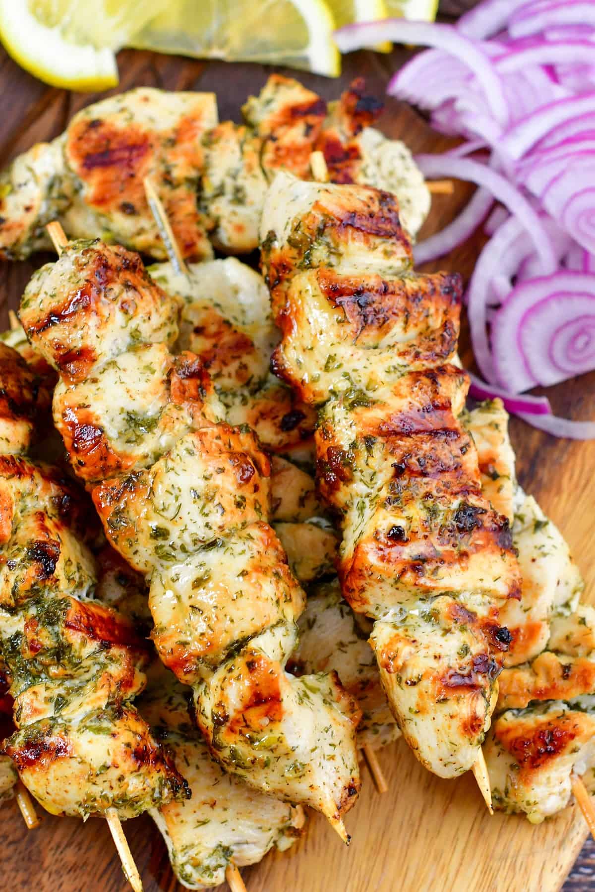 closeup of grilled chicken souvlaki on skewers