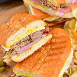 sliced Cuban sandwich halves stacked on the angle