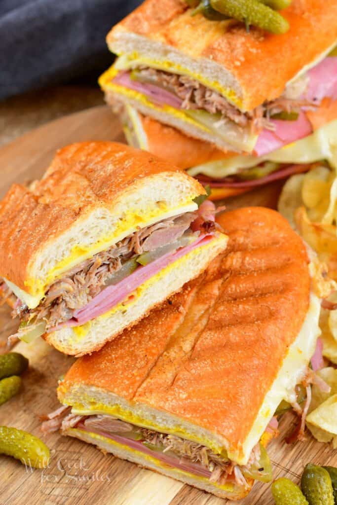 sliced Cuban sandwich halves stacked on the angle