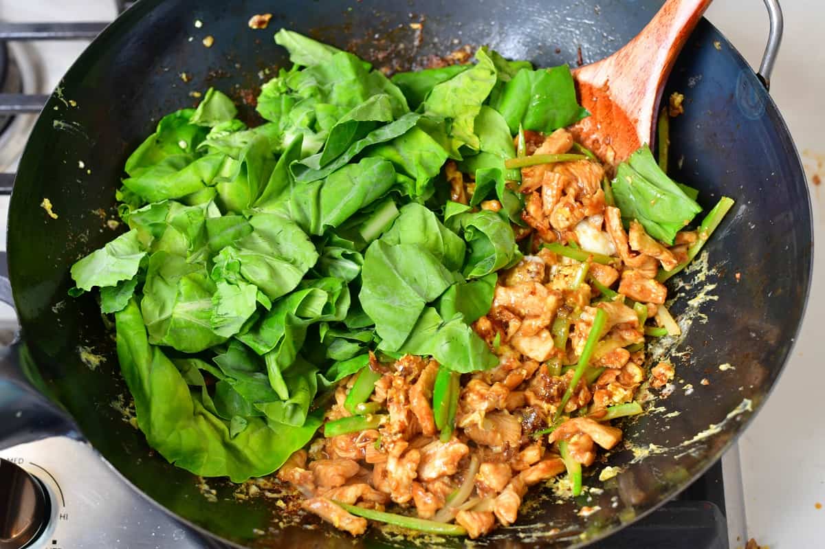 adding Chinese broccoli leaves for the wok