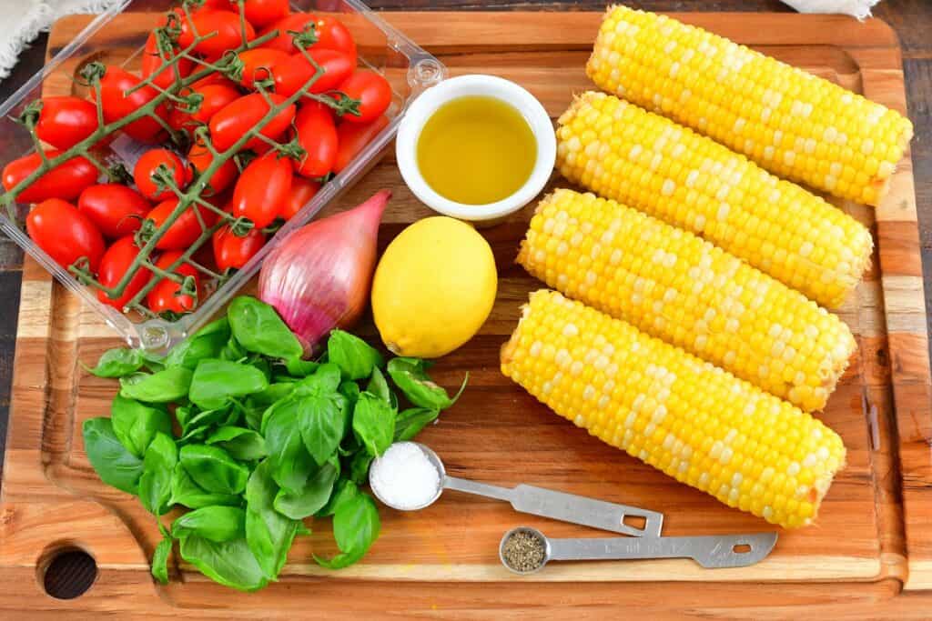 ingredients for the tomato corn salad in the board