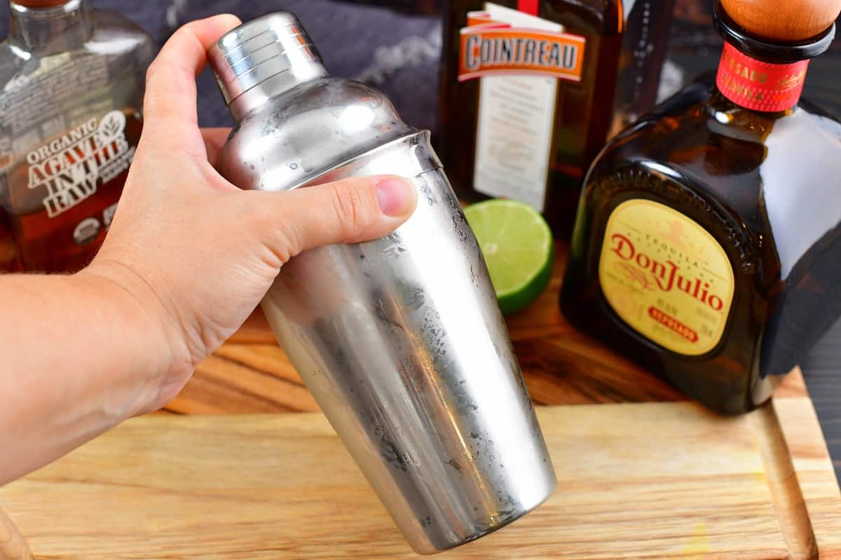 shacking the margarita in a shaker