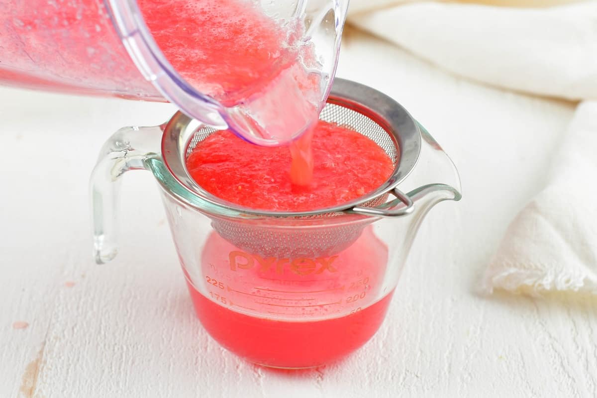 straining watermelon juice