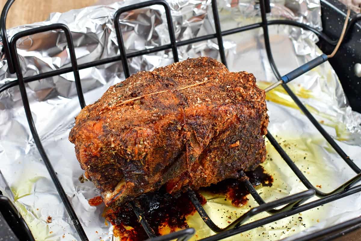 cooked pork shoulder in the roasting pan.
