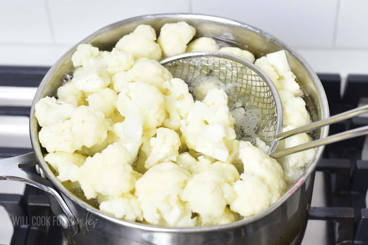 blanching cauliflower in a pot.