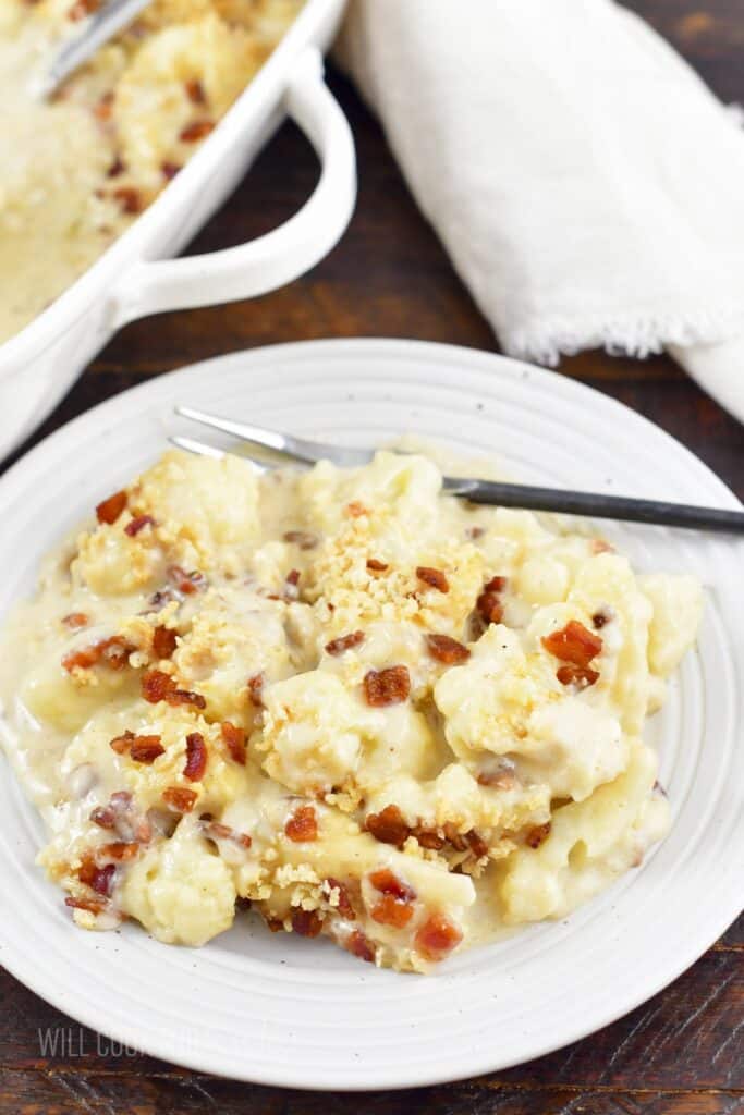 top view of the cheesy cauliflower casserole on a plate.