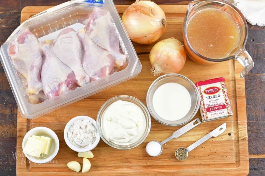 ingredients to make chicken paprikash on the board