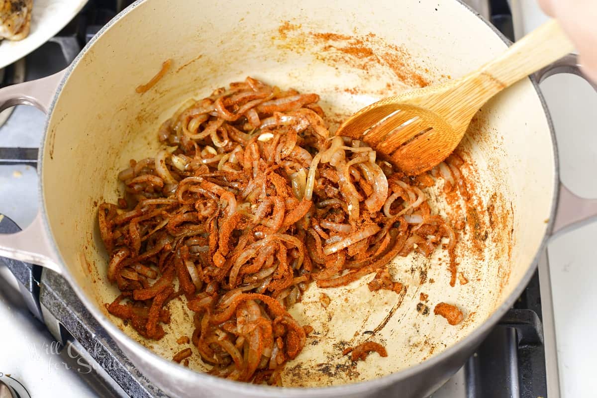 mixing paprika into the sautéed onions