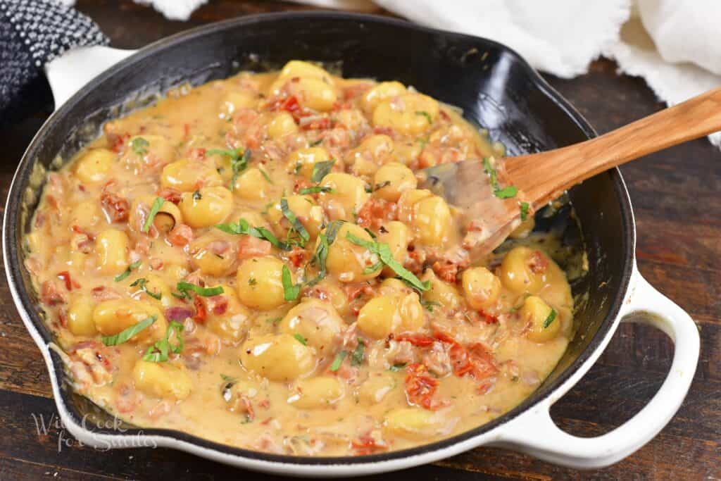 cooked creamy gnocchi dish in the pan