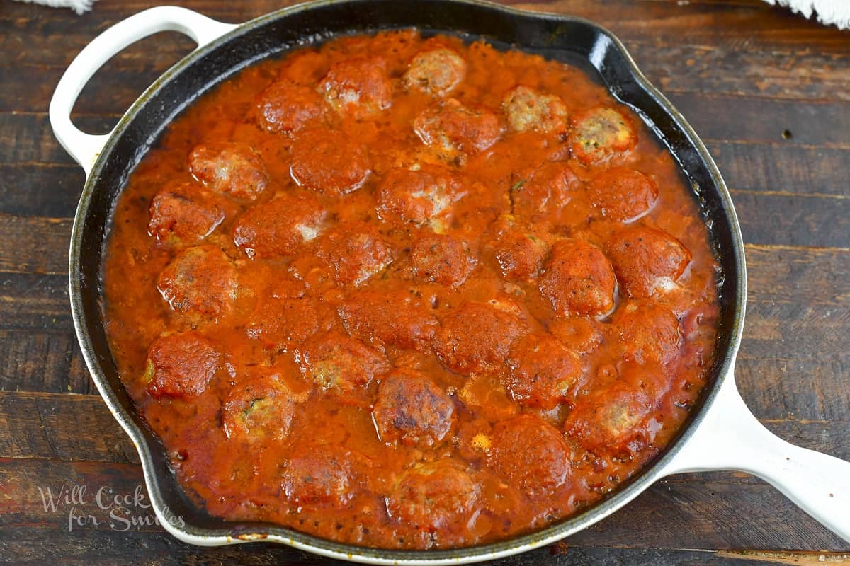 baked meatballs in marinara sauce in the skillet
