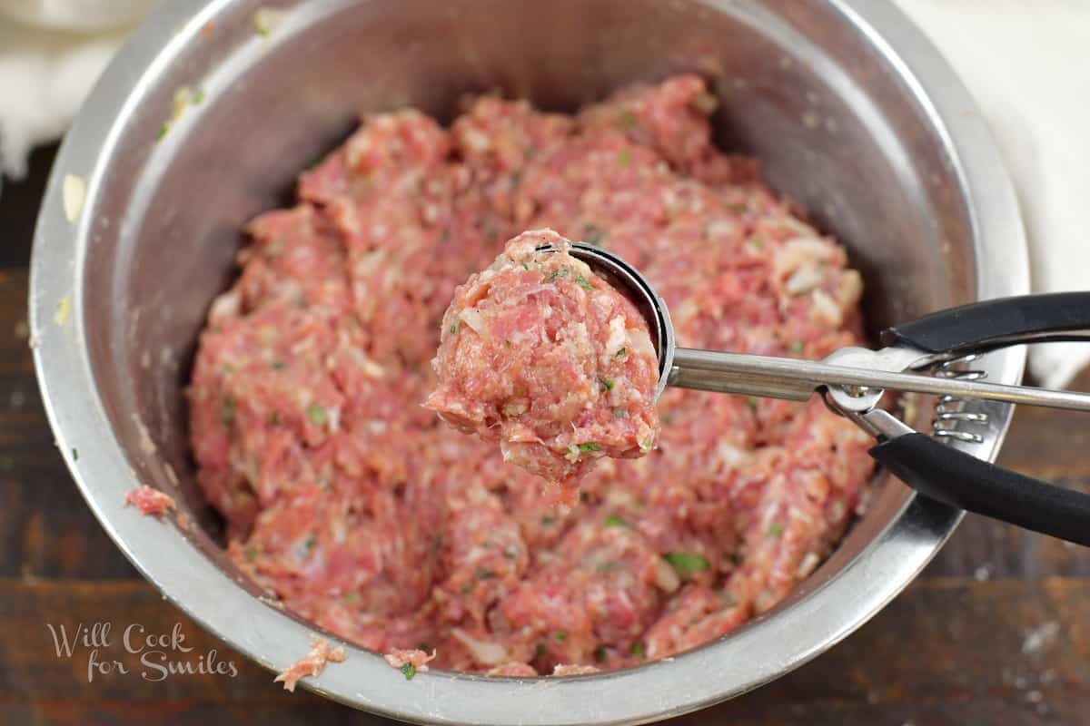meat mixture in a scoop to form a meatball
