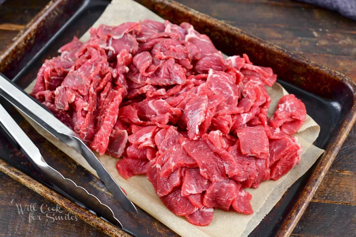 thinly sliced steak in parchment