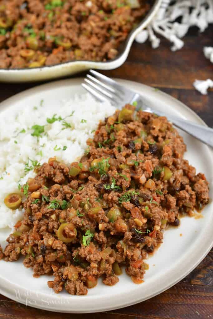 beef picadillo on the plate with a side of rice