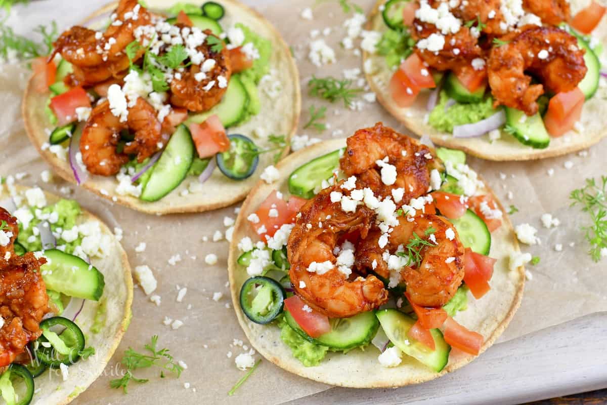 closeup top view of shrimp tostada with veggies