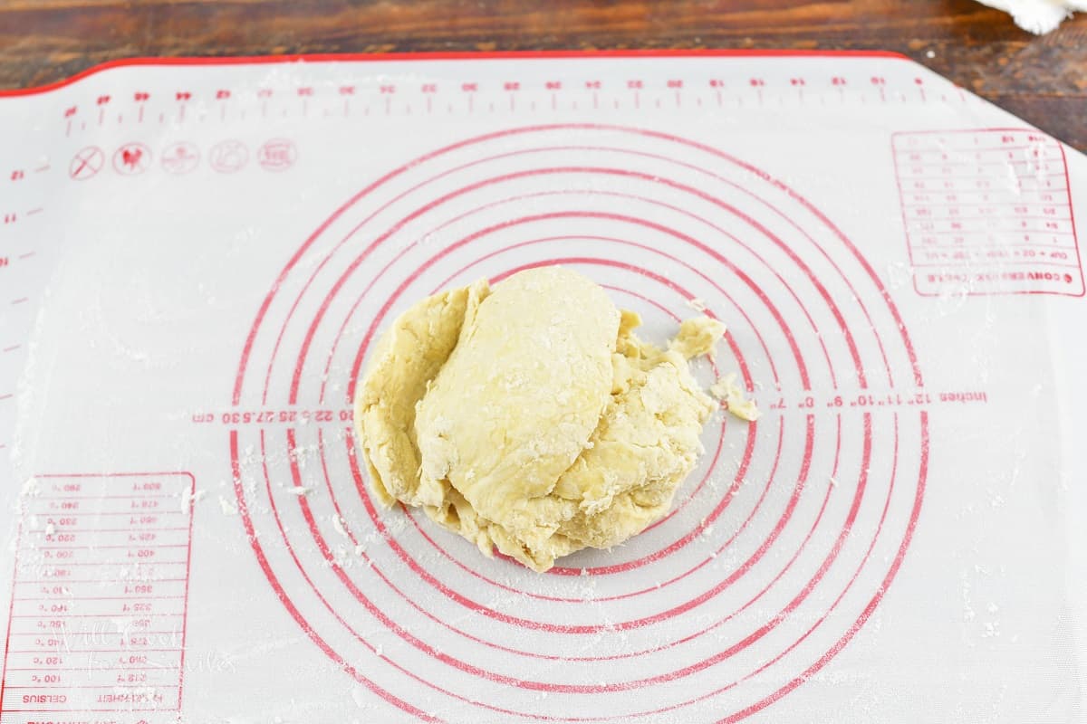 dough before kneading on silicone mat.