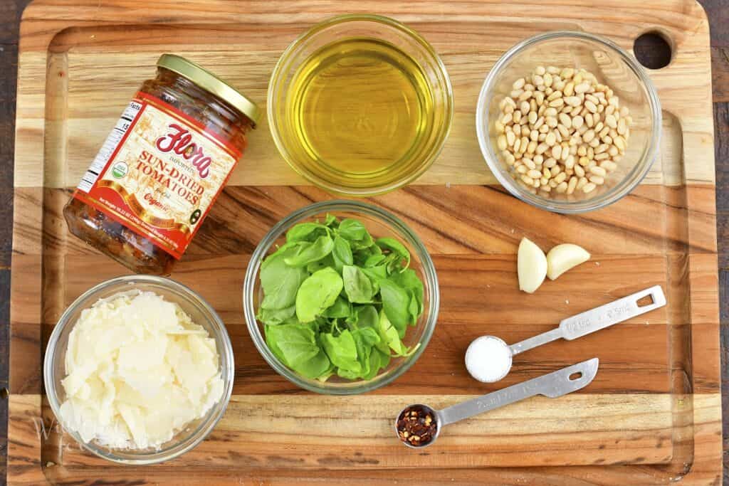 ingredients for sun-dried tomato pesto on the board