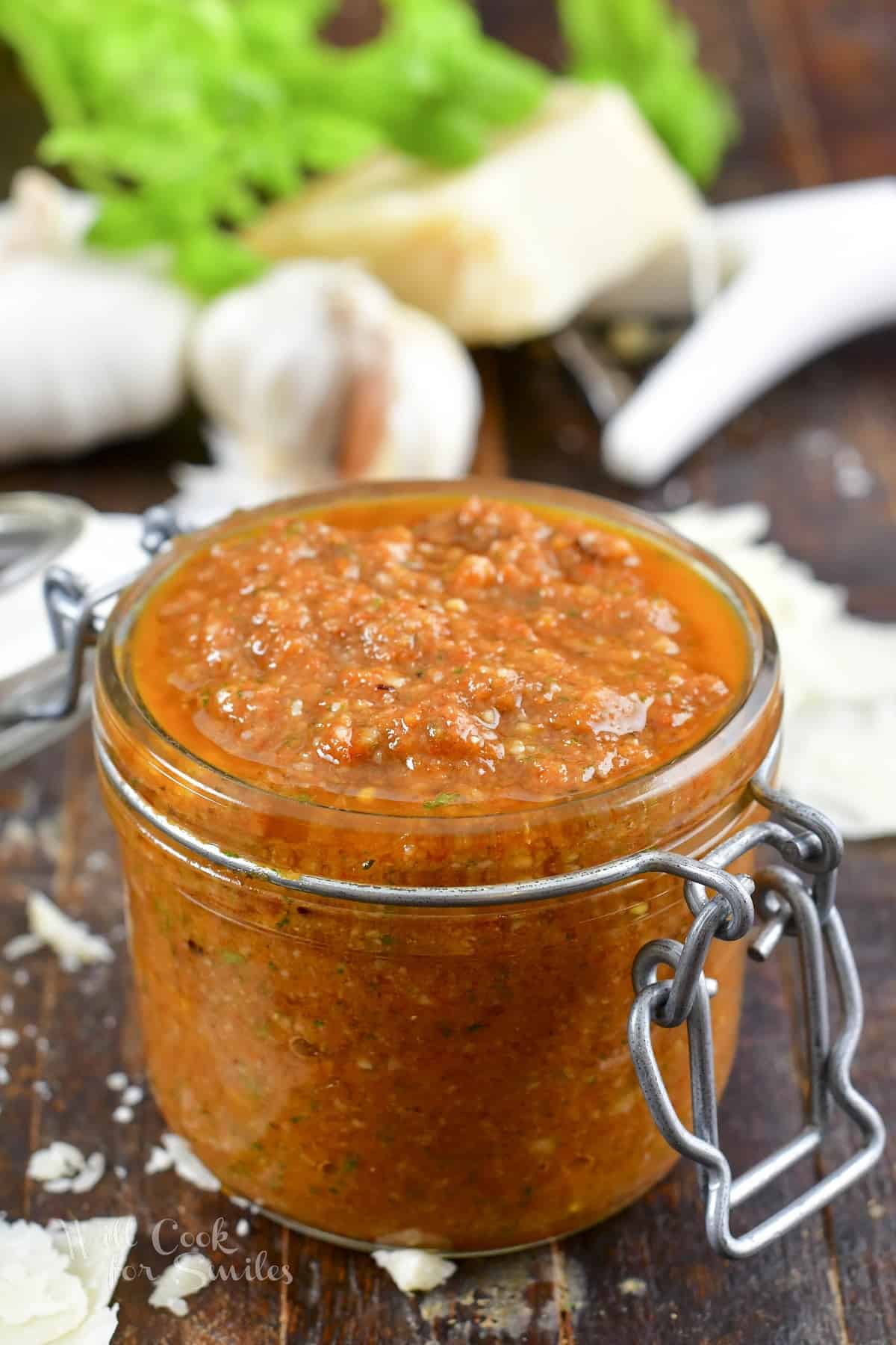 closeup sun-dried tomato pesto in a glass jar