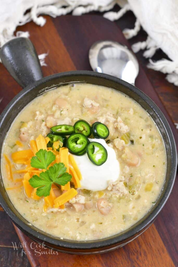 top view of the turkey chili in the bowl with a spoon