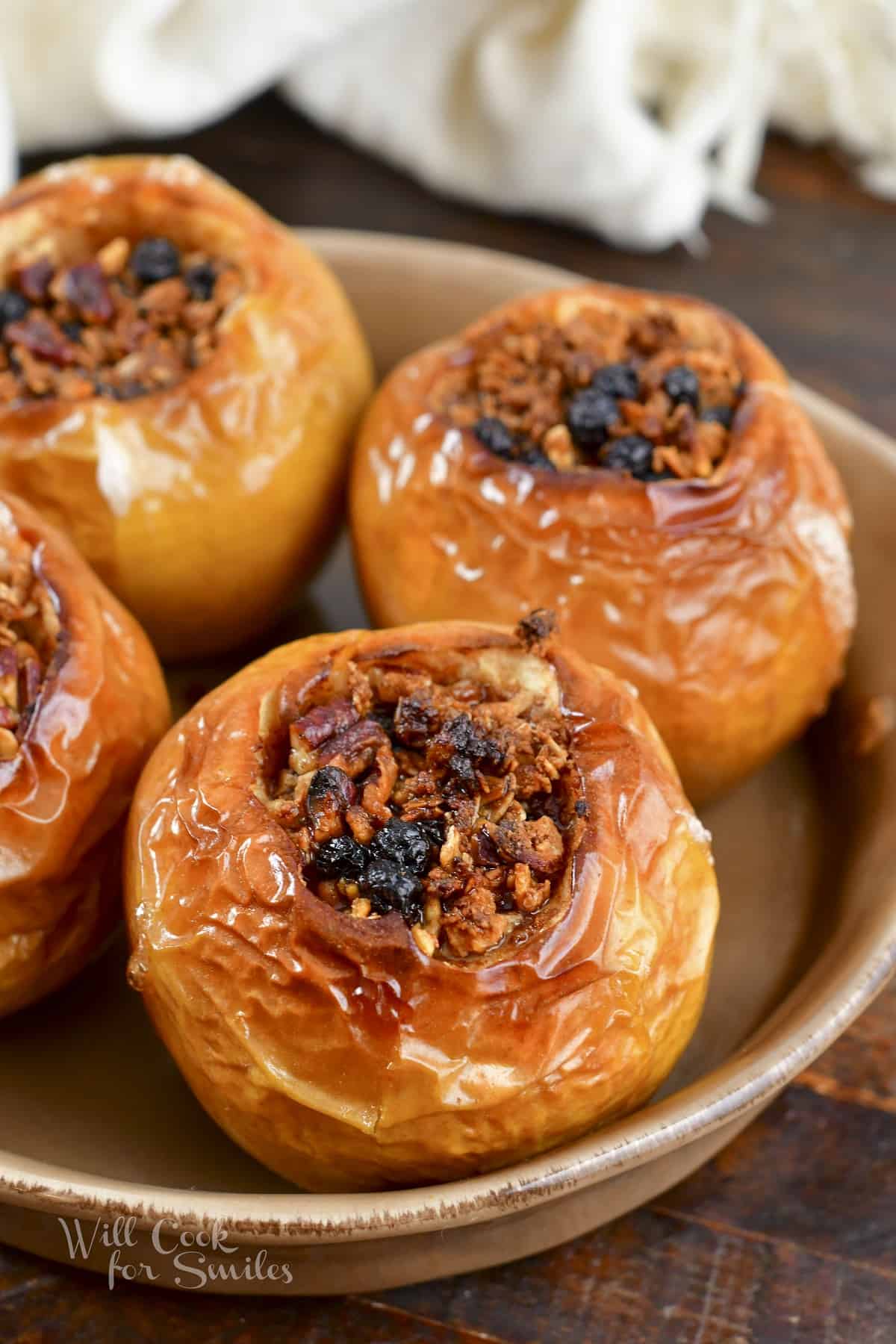 closeup of baked apples in a baking dish