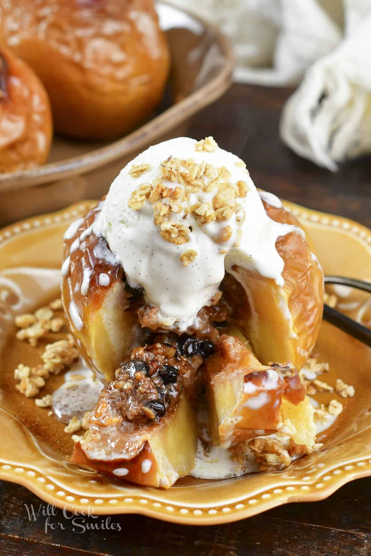 baked apple with ice cream with cut slices
