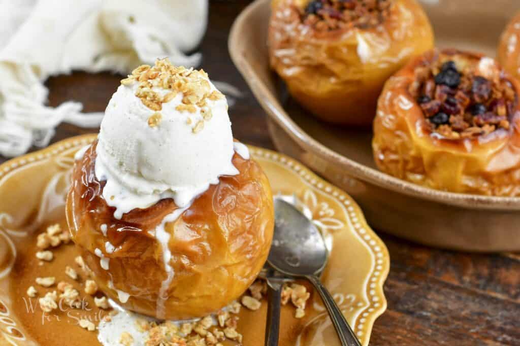 baked apple with ice cream on a place and more in a dish