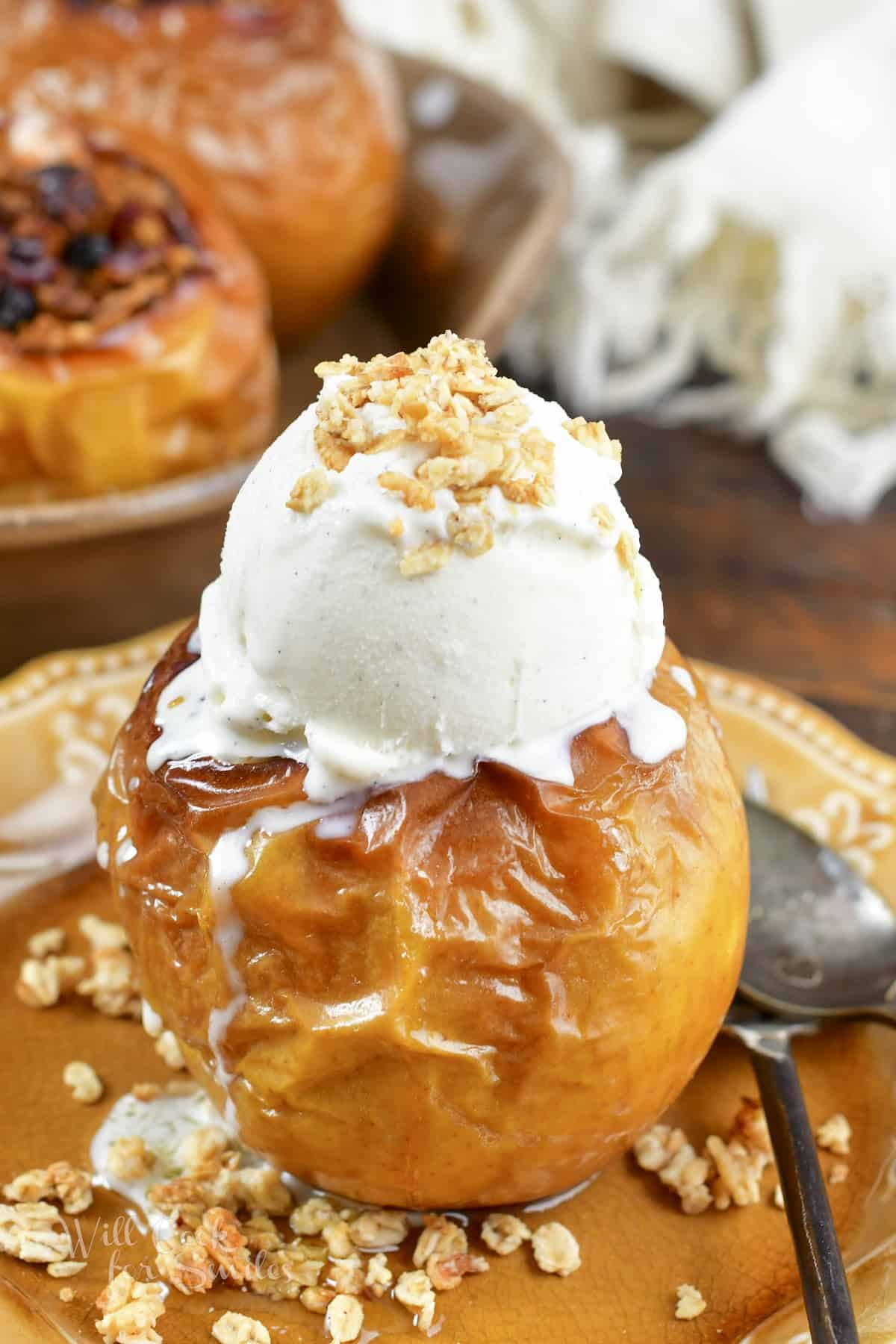 baked apple topped with vanilla ice cream
