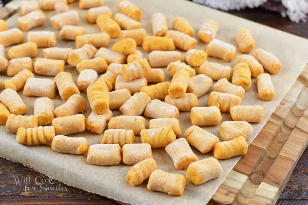 sweet potato gnocchi pieces spread out on parchment