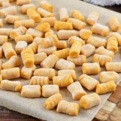 sweet potato gnocchi pieces spread out on parchment