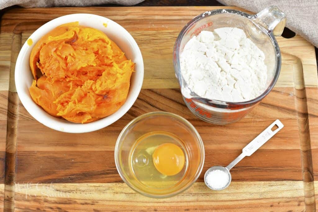 ingredients to make sweet potato gnocchi in the board