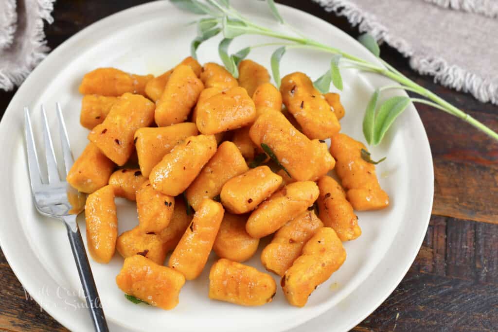 cooked orange gnocchi in butter, sage, and red pepper flakes