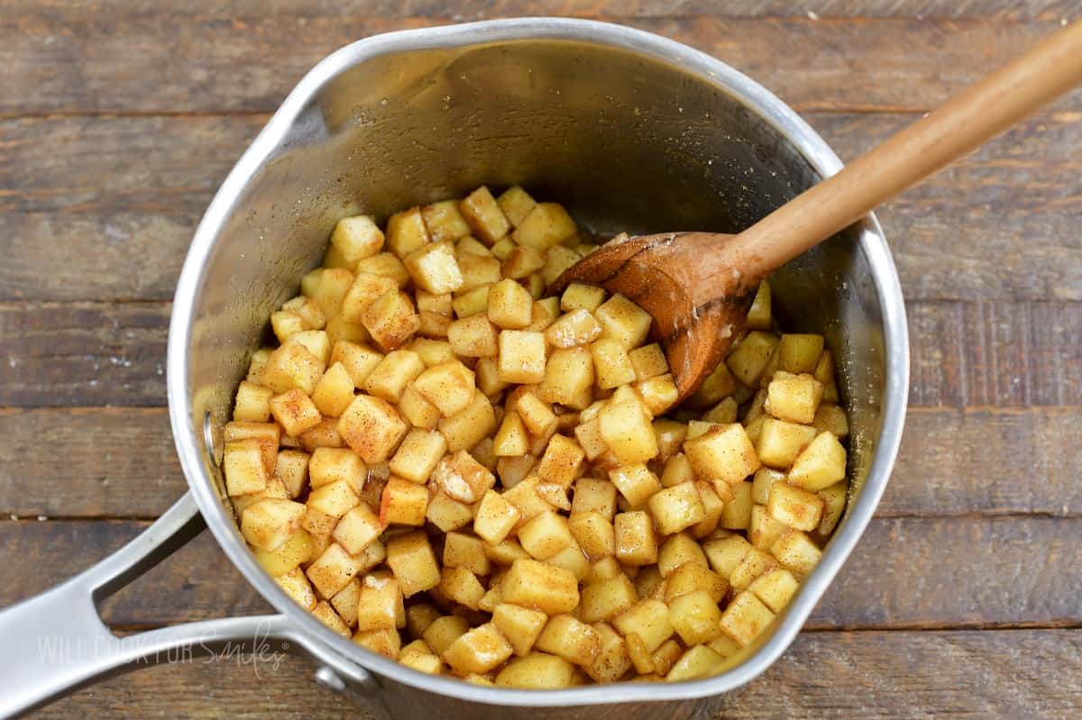 mixed apple pie topping in a sauce pot.