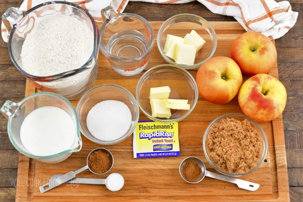 ingredients to make apple monkey bread on cutting board.
