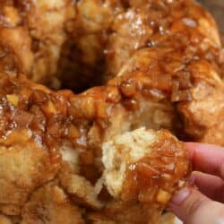 closeup of pulling off a piece of monkey bread.