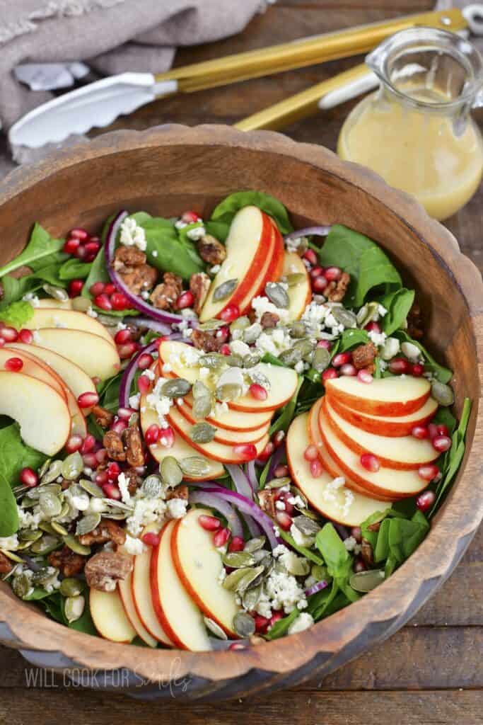 top view of apple salad put together in a wooden bowl.